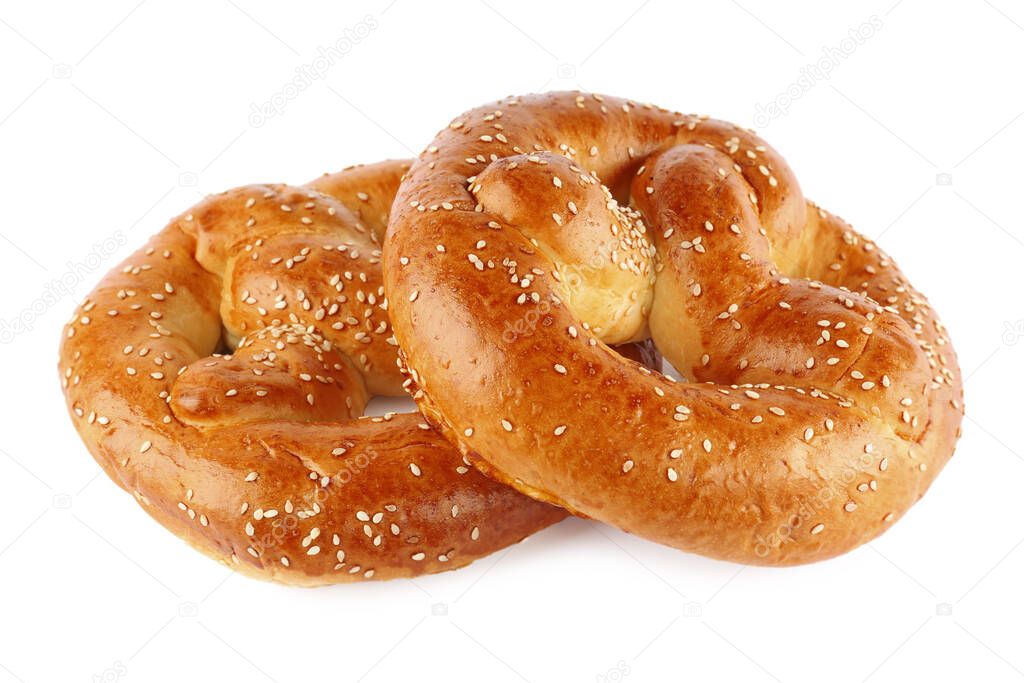 Tasty freshly baked pretzels on white background