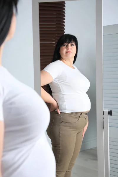 Overweight Woman Tight Shirt Trousers Mirror Home — Stock Photo, Image