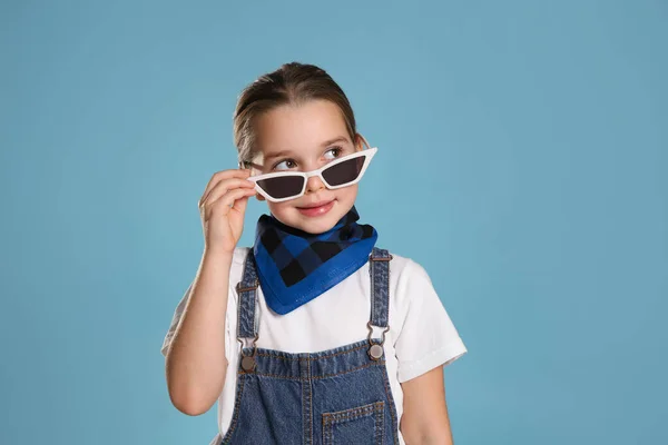 Cute Little Girl Wearing Stylish Bandana Sunglasses Turquoise Background — Φωτογραφία Αρχείου