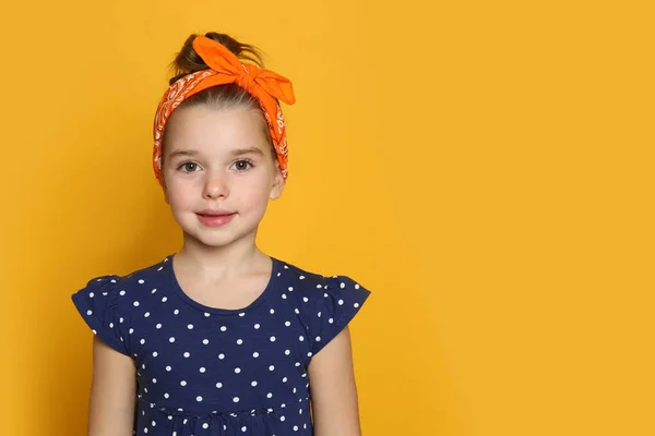 Cute Little Girl Wearing Stylish Bandana Orange Background Space Text — Φωτογραφία Αρχείου