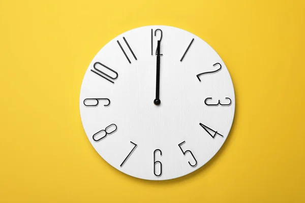 Modern Clock Yellow Background Top View — Stock Photo, Image