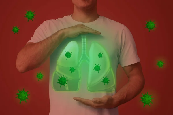 肺とウイルスのイラストで胸の近くに手を握っている男赤い背景で彼を取り巻くクローズアップ — ストック写真