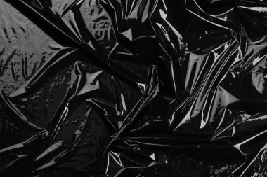 Arka plan olarak siyah plastik streç film, üst görünüm
