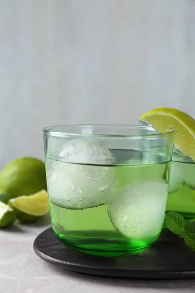 Delicious Cocktail Lime Ice Balls Grey Table Space Text — Stock Photo, Image