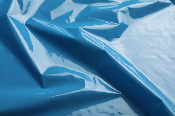 Closeup view of light blue plastic stretch wrap film as background