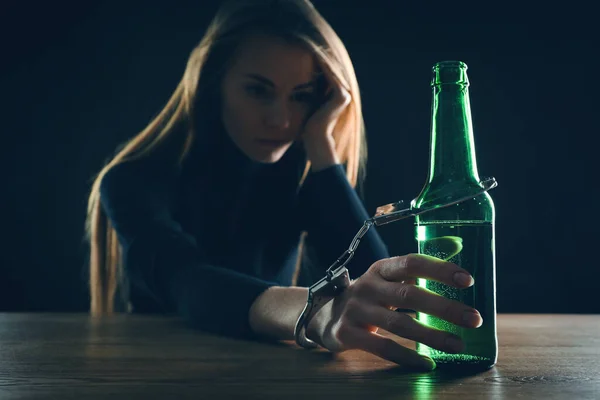 Alcohol Addiction Woman Handcuffed Bottle Beer Wooden Table Black Background — Stock Photo, Image