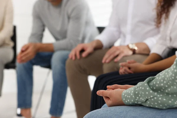 People at group therapy session indoors, closeup