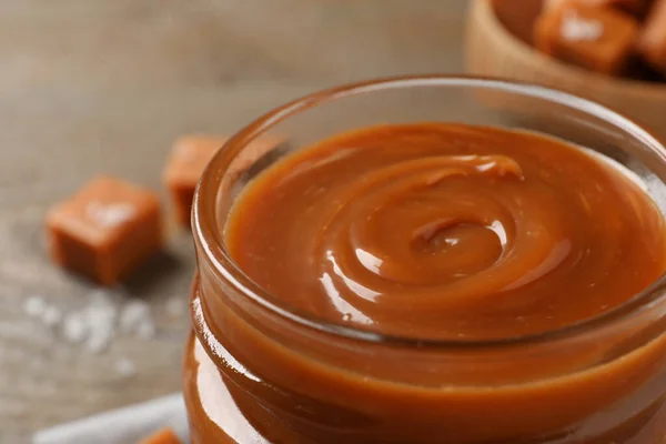 Yummy Salted Caramel Glass Jar Table Closeup — Stockfoto