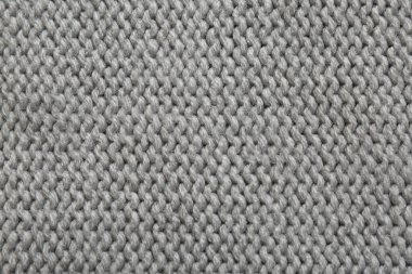 Arka plan olarak güzel gri örülmüş kumaş, üst görünüm
