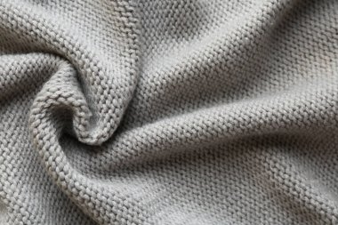 Arka plan olarak güzel gri örülmüş kumaş, üst görünüm