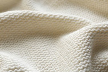 Arka plan olarak güzel beyaz örülmüş kumaş, yakın plan