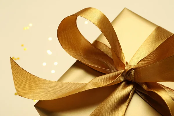 Beautiful Golden Gift Box Beige Background Closeup — Stock Photo, Image