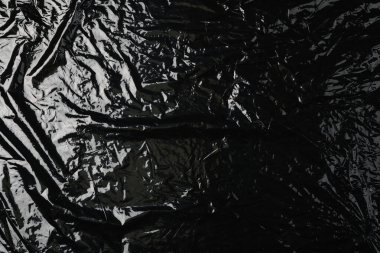Arka plan olarak siyah plastik streç film, üst görünüm