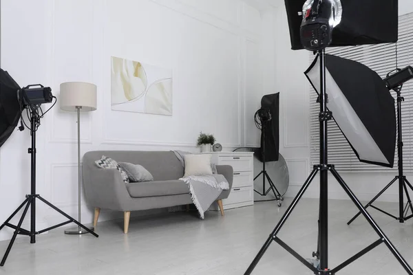 Set Stylish Furniture Surrounded Professional Lighting Equipment Photo Studio Cozy — Stock Photo, Image