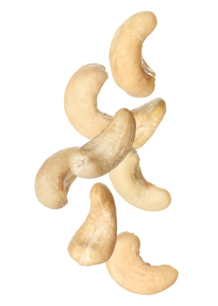 Tasty Raw Cashew Nuts Falling White Background — Stock Photo, Image