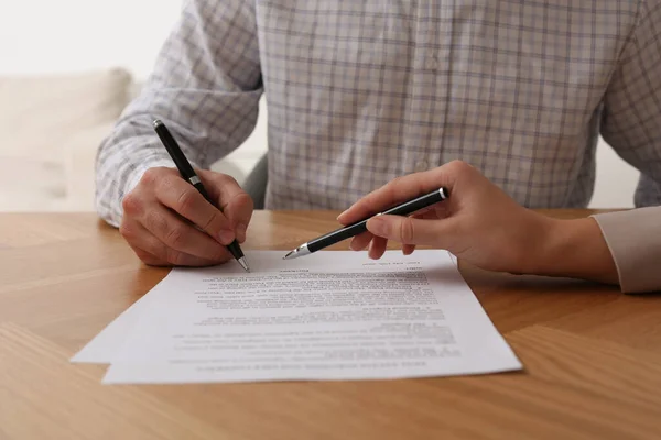 Businesspeople Signing Contract Wooden Table Indoors Closeup Hands — Stockfoto