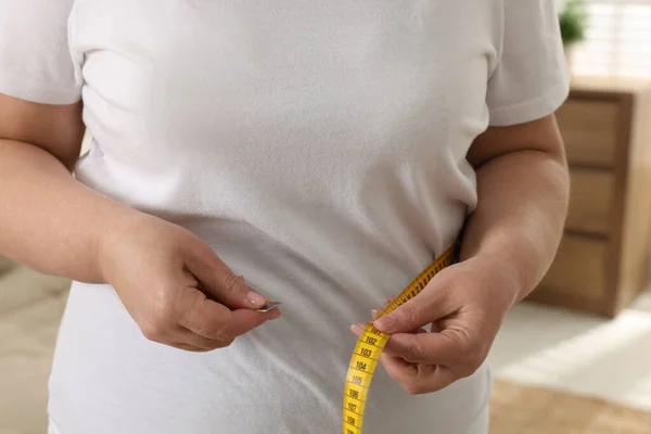 Overweight Woman Measuring Waist Tape Home Closeup — Stock Photo, Image