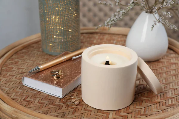 Burning Soy Candle Notebook Stylish Accessories Wicker Table Indoors — Stock Photo, Image