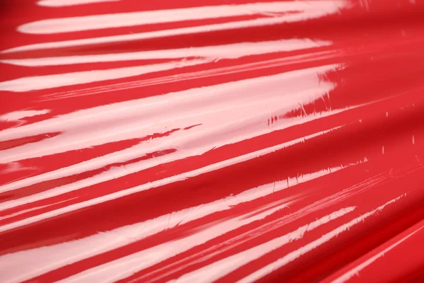Röd Plast Stretch Wrap Som Bakgrund Närbild — Stockfoto