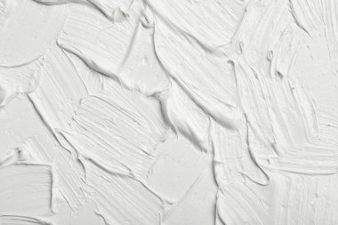 Texture of white oil paint as background, closeup clipart