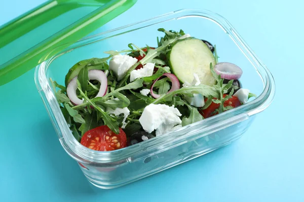 Tasty Salad Glass Container Light Blue Background — Stock Photo, Image