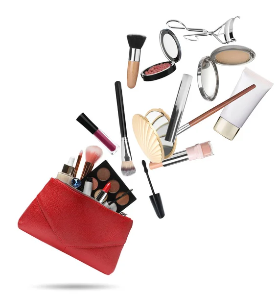 Different Makeup Products Falling Stylish Cosmetic Bag White Background — Stock Photo, Image