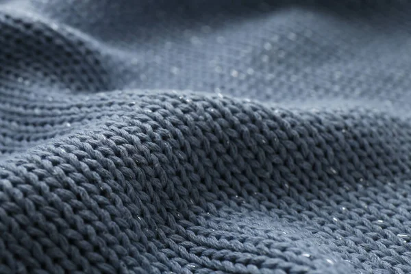 Arka plan olarak güzel soluk mavi örgü kumaş, yakın plan