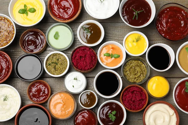 Many Different Sauces Herbs Wooden Table Flat Lay — Stock Photo, Image