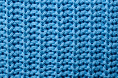 Arka plan olarak güzel açık mavi örgü kumaş, üst görünüm