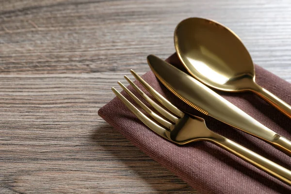 Set Golden Cutlery Napkin Wooden Table Closeup Space Text — Stock Photo, Image
