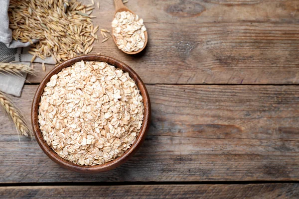 Cuenco Con Harina Avena Mesa Madera Puesta Plana Espacio Para —  Fotos de Stock