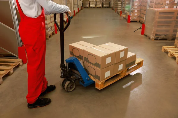 Worker Moving Cardboard Boxes Manual Forklift Warehouse Closeup Logistics Concept — Stock Photo, Image