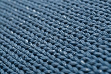 Arka plan olarak güzel soluk mavi örgü kumaş, yakın plan