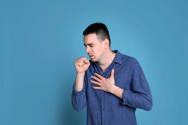 Young Man Coughing Blue Background Space Text Cold Symptoms — Stock Photo, Image