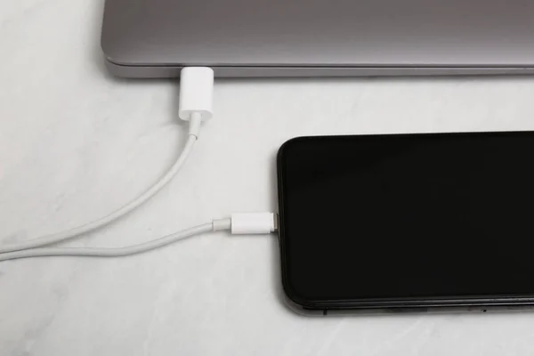 Smartphone Connected Charge Cable Laptop Light Table Closeup — Stock Photo, Image