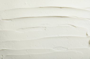 Arka plan olarak lezzetli krem peynirin yakın çekimi, üst görünüm