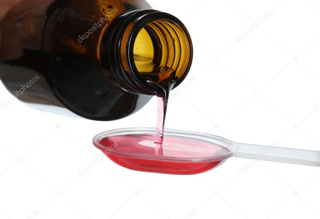 Pouring cough syrup into dosing spoon on white background