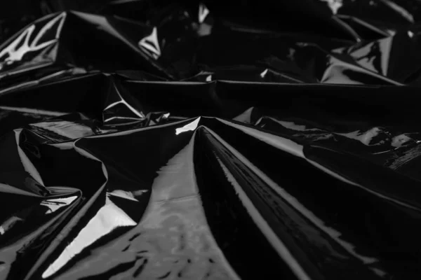 Closeup view of black plastic stretch wrap film as background