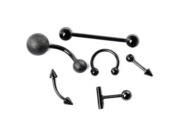 Joyería Piercing Negro Con Estilo Sobre Fondo Blanco Vista Superior — Foto de Stock