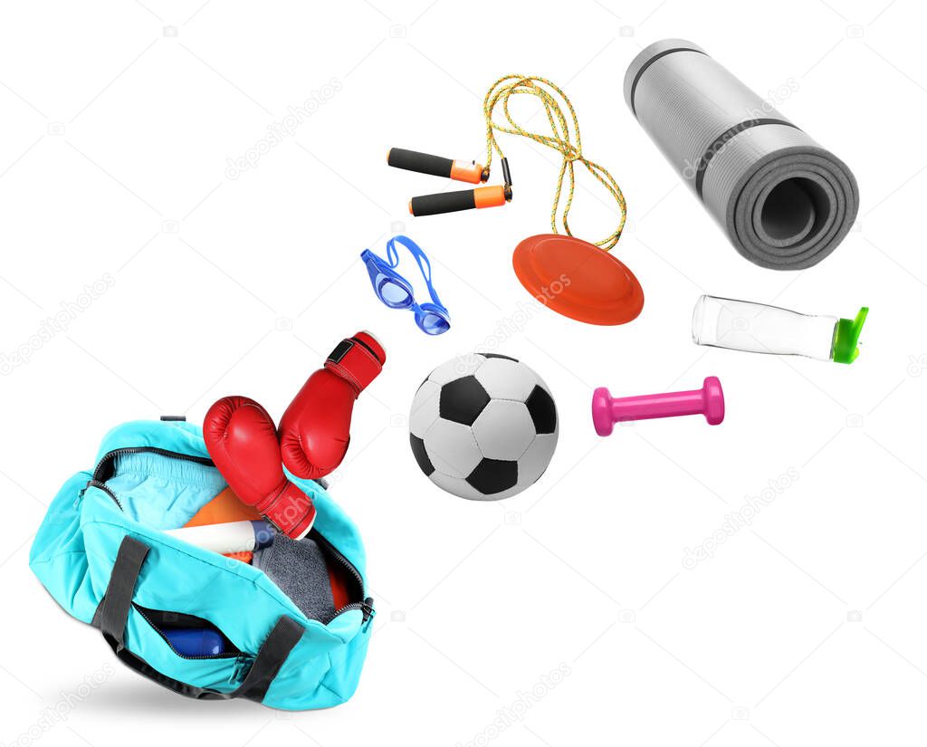 Sports bag and different gym stuff flying on white background