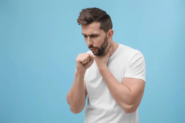 Man Coughing Light Blue Background Space Text Cold Symptoms — Stock Photo, Image