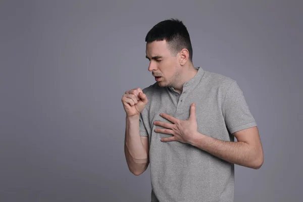 Young Man Coughing Grey Background Space Text Cold Symptoms — Stock Photo, Image
