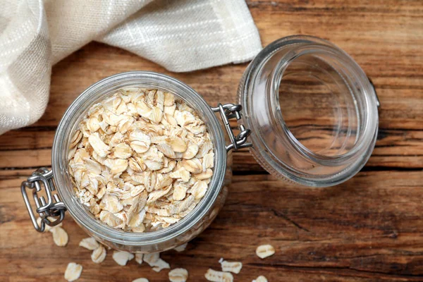 Tarro Vidrio Con Harina Avena Sobre Mesa Madera Plano —  Fotos de Stock