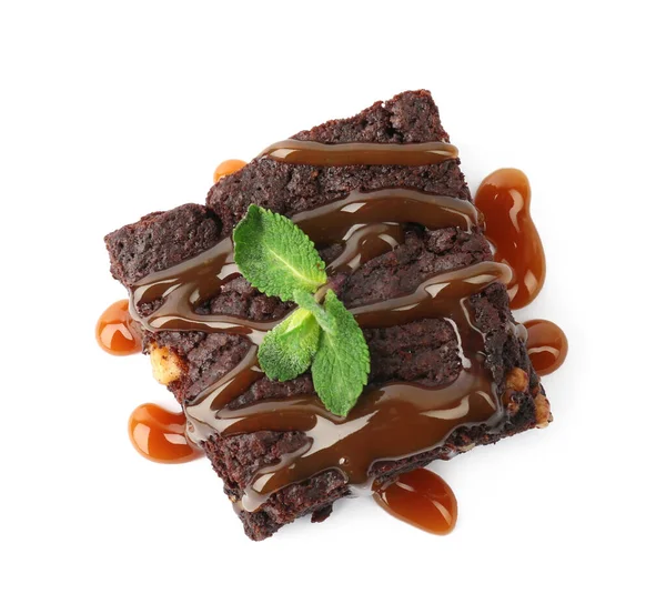 Delicious Chocolate Brownies Nuts Caramel Sauce Fresh Mint White Background — Stock Photo, Image