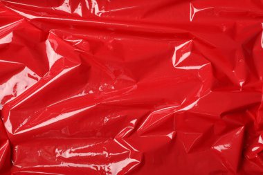 Arka plan olarak kırmızı plastik germe paketi, üst görünüm