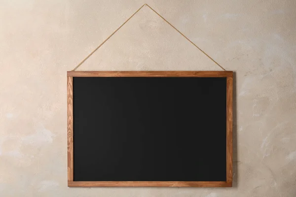 Clean Black Chalkboard Hanging Beige Wall — Stock Photo, Image