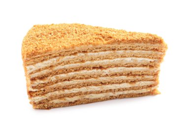 Beyaz üzerine izole edilmiş bir dilim lezzetli ballı pasta.