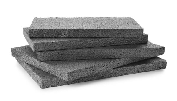 Stack of grey styrofoam sheets on white background