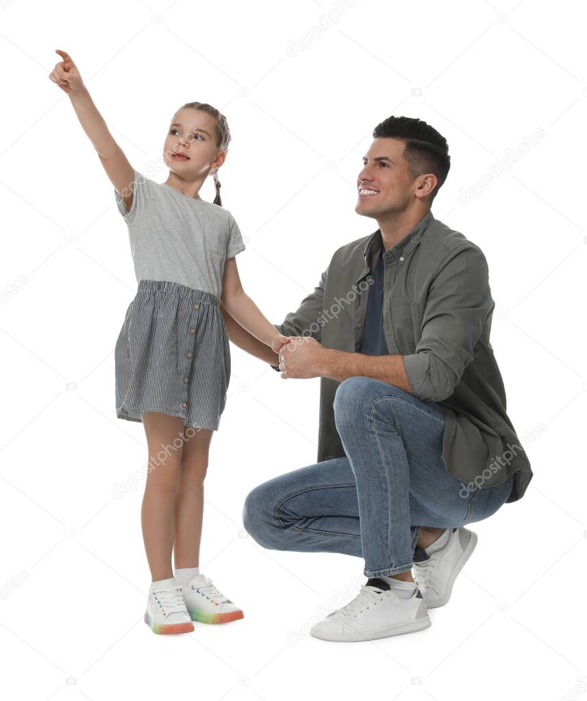 Little girl with her father on white background