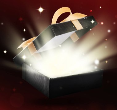 Karanlık arka planda sihirli ışığı olan güzel hediye kutusu.,